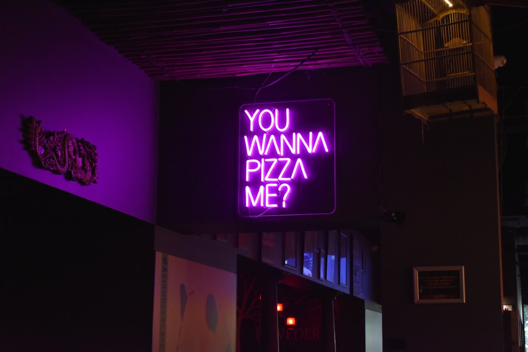 neon pizza sign at local bar in Melbourne.