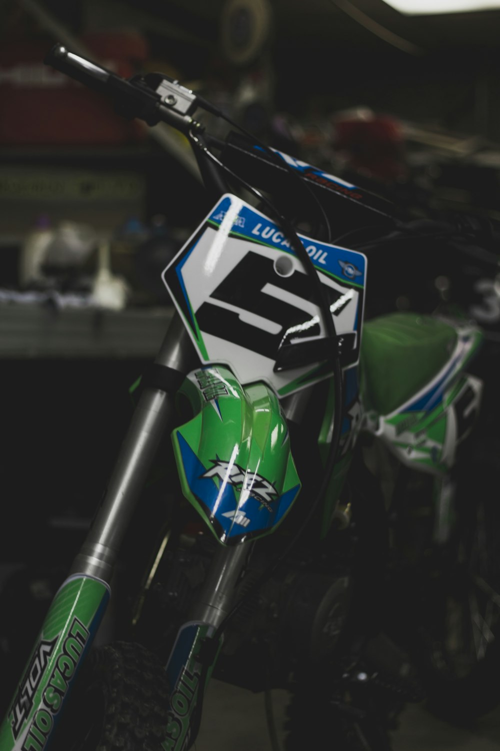 green and black motocross dirt bike