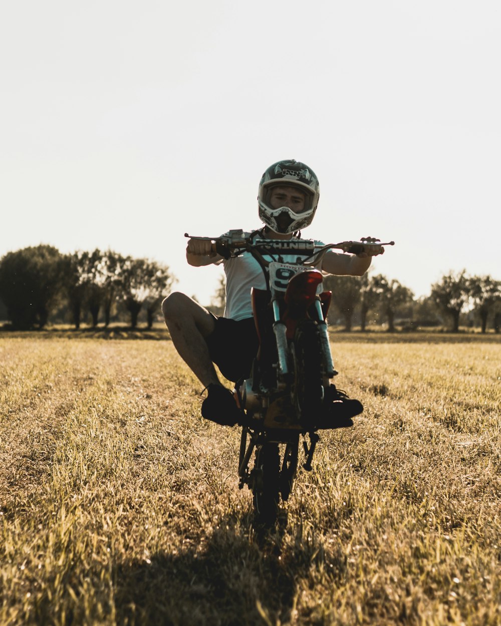 man riding dirt bike during daytime