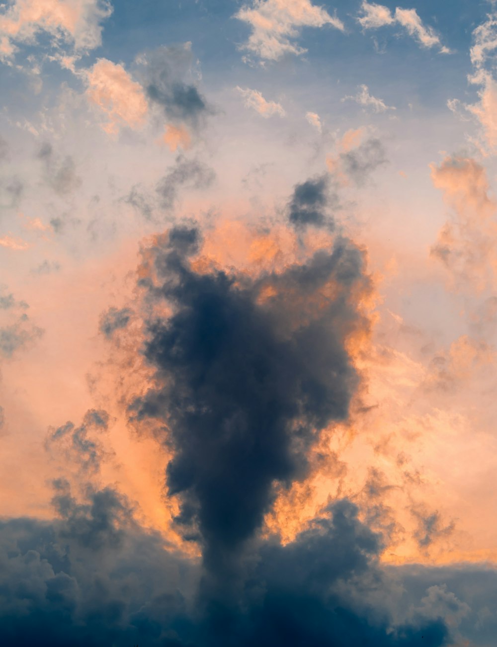 white clouds at golden hour