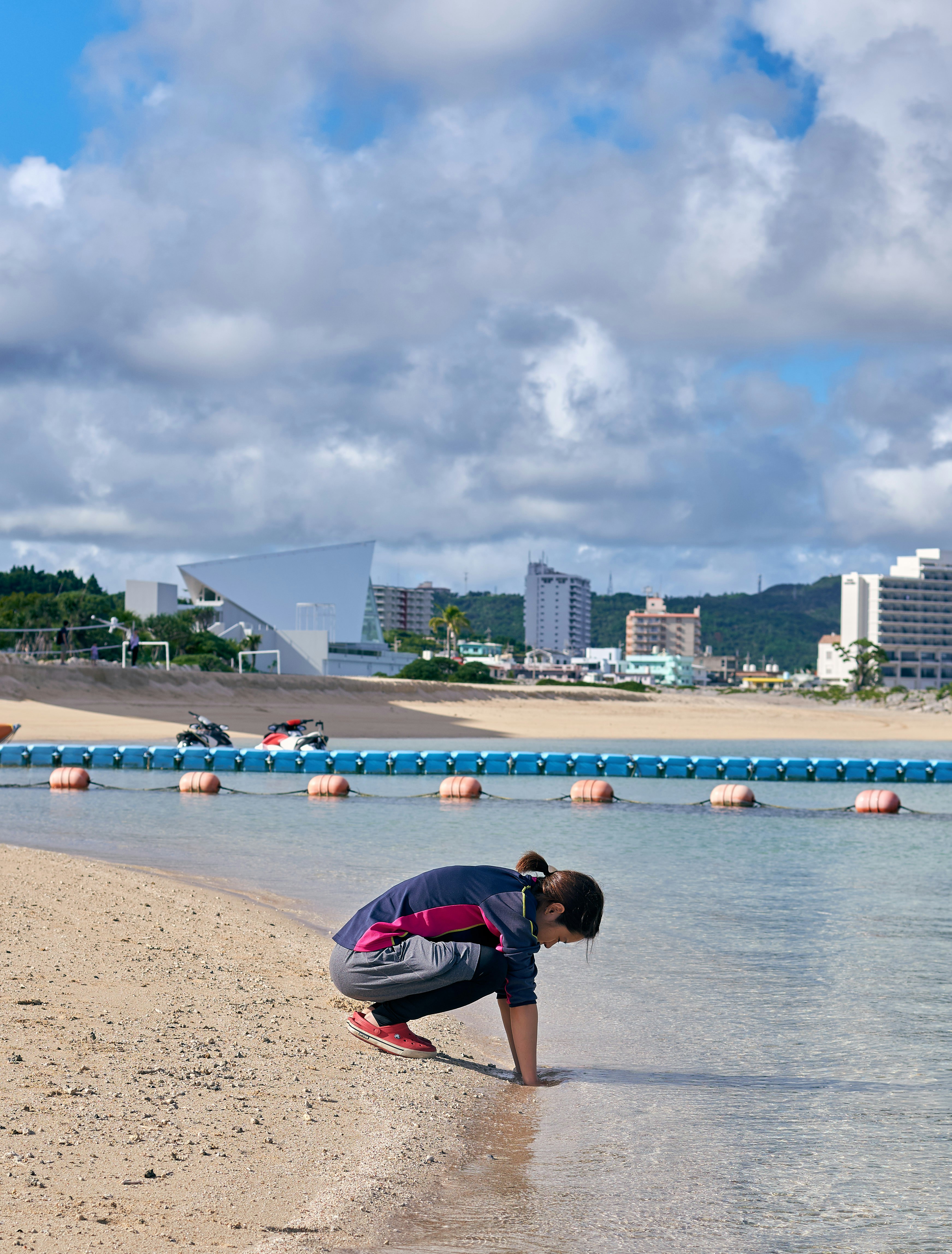 person's hand on shore