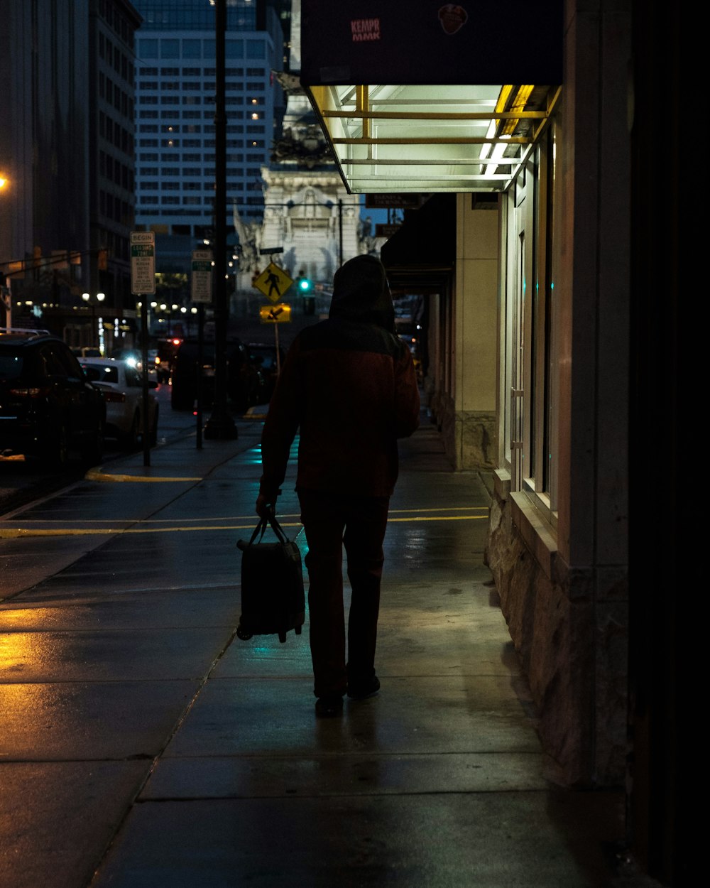 person holding bag on street