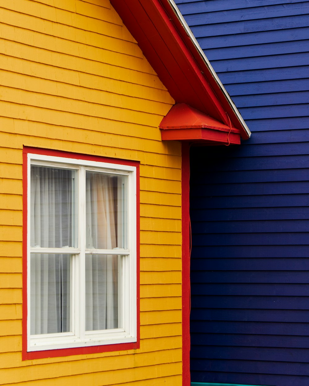 yellow and red wooden house