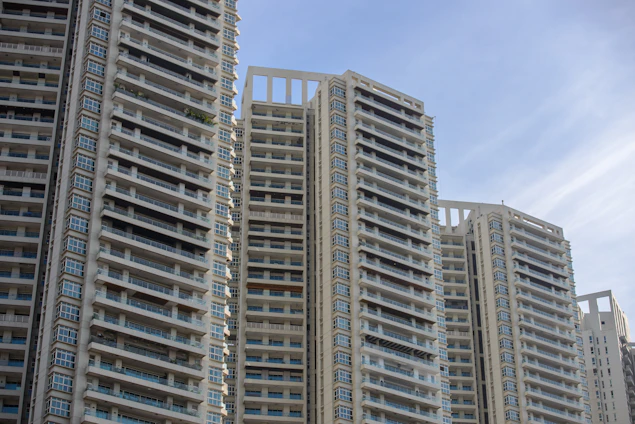 Panoramic view of modern residential buildings in Medina with clear blue sky.