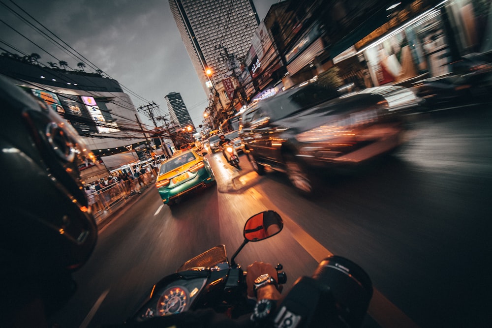 time lapse photography of vehicles crossing road