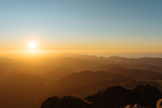 Scenic view of Machu Picchu at sunrise with soft golden light.