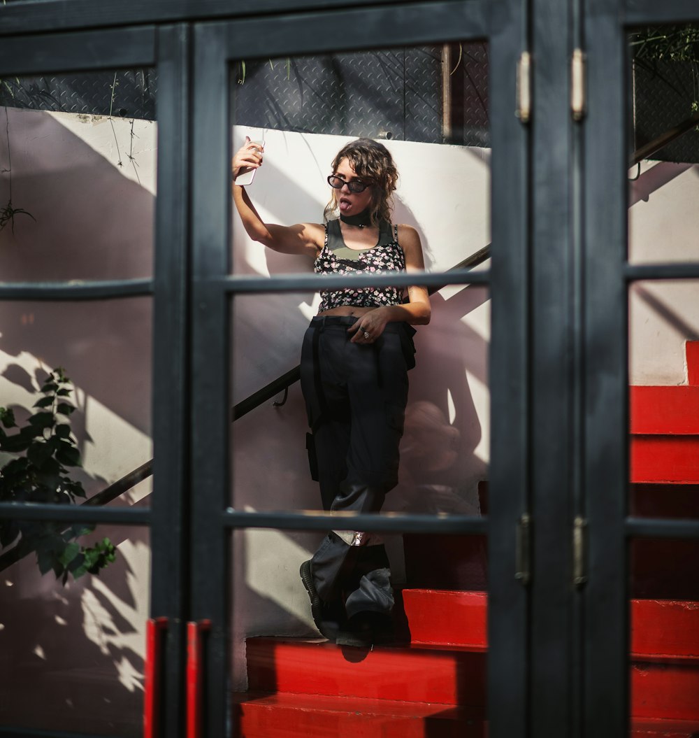 woman standing beside stairs