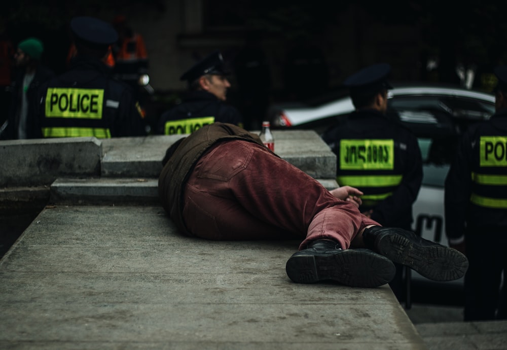 man lying on concrete island