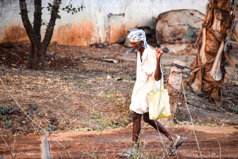 man carrying basket