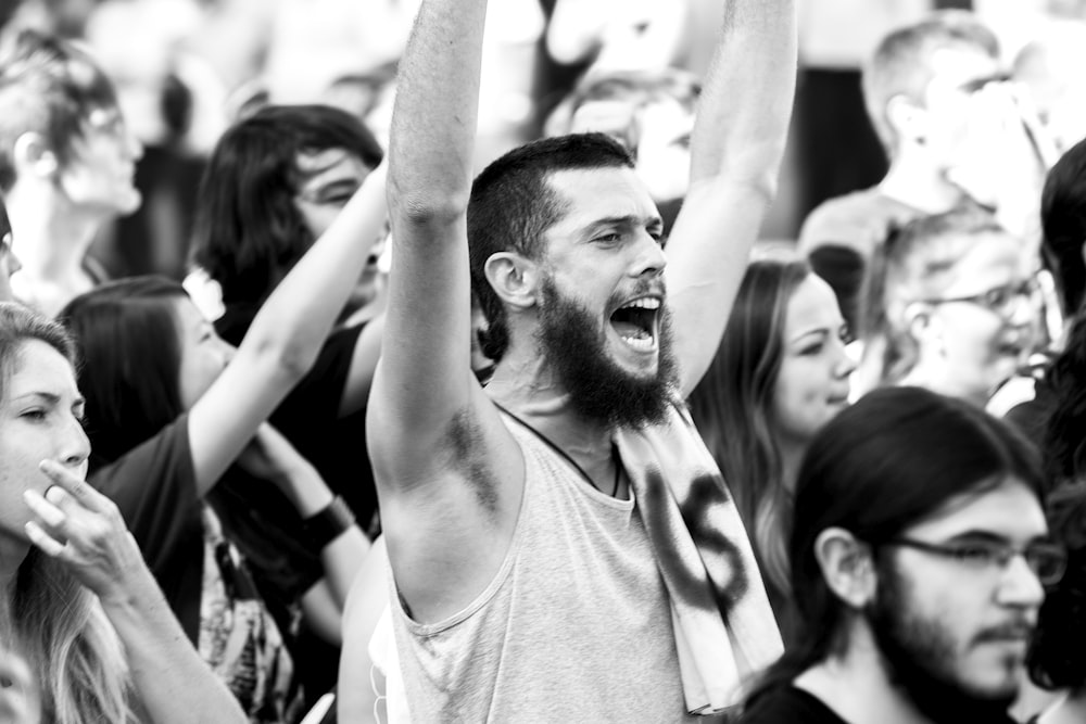 man raising hands