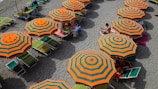 orange and green beach umbrella view