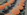 orange and green beach umbrella view