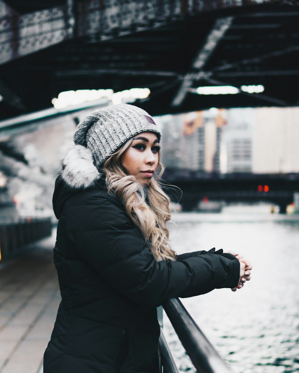 woman wearing black bobble jacket standing