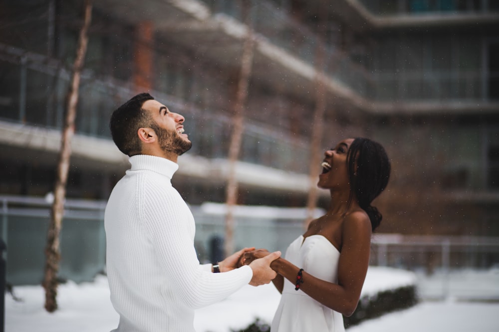 man and woman smiling