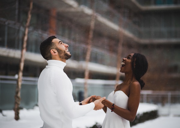 man and woman smiling