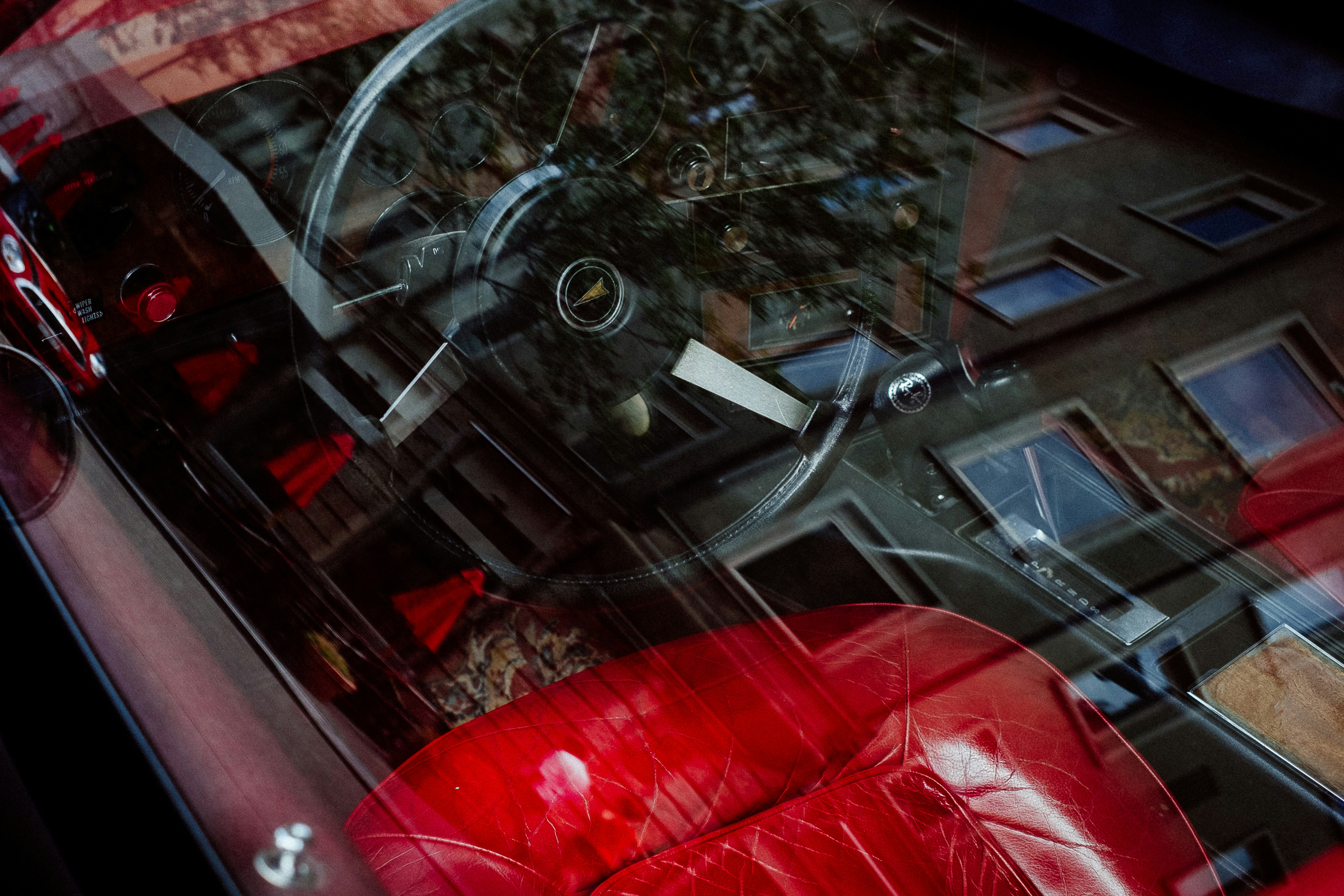 reflection of building on vehicle glass