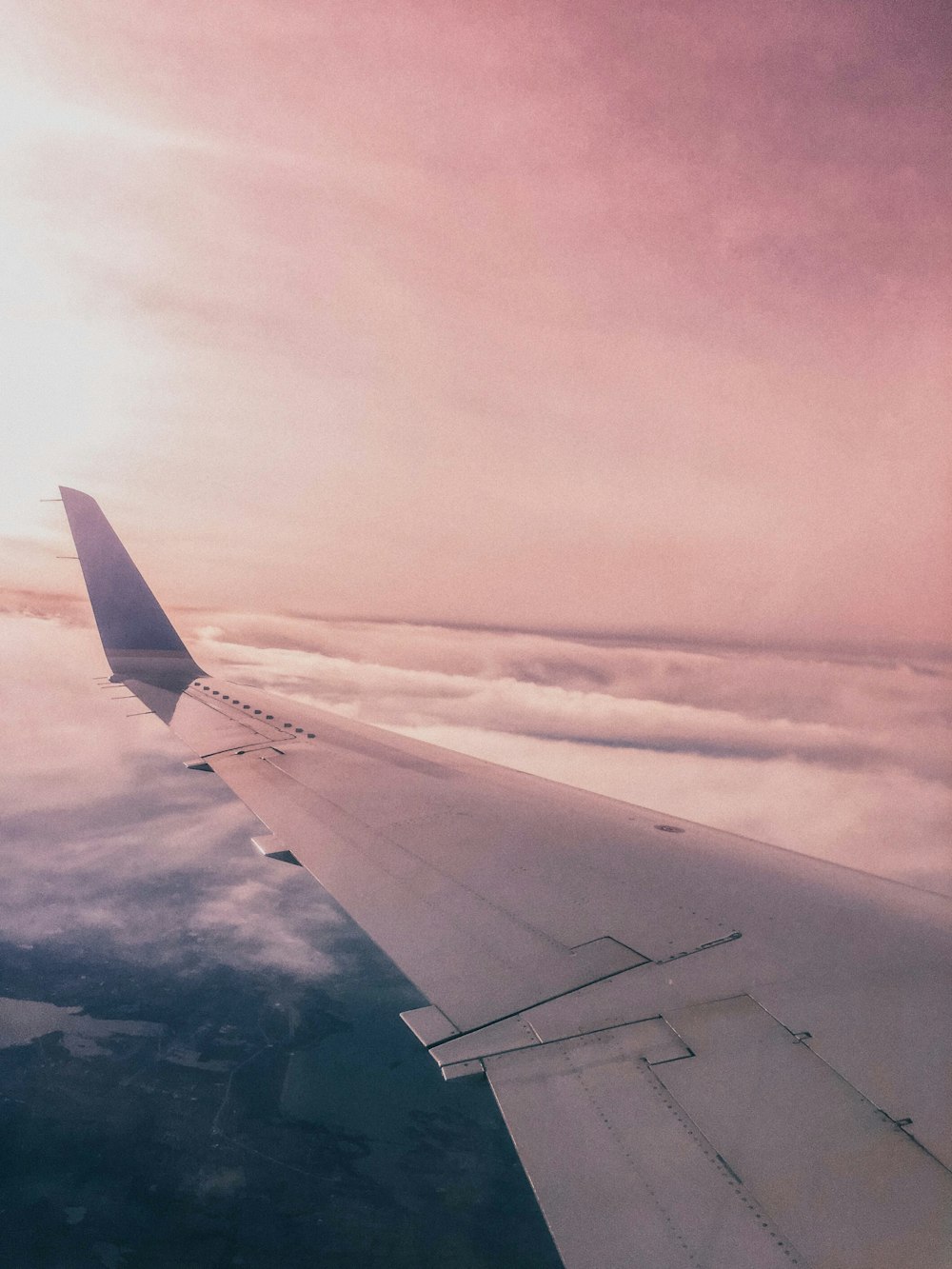 passenger plane above white clouds