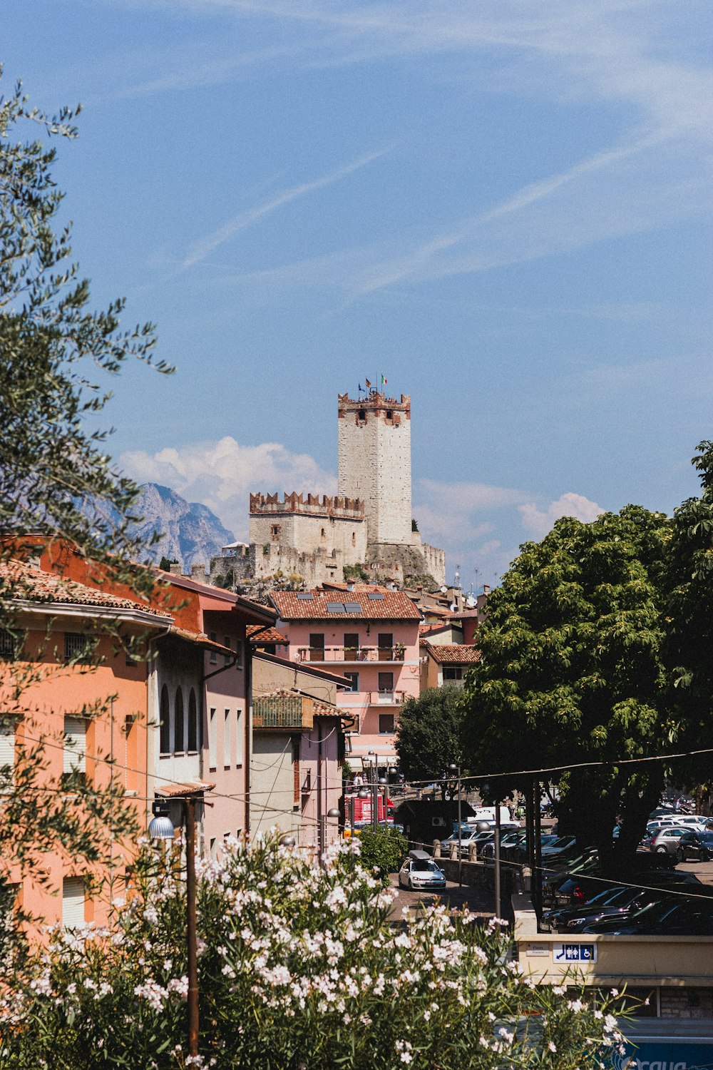 grey castle at hilltop under blue sky