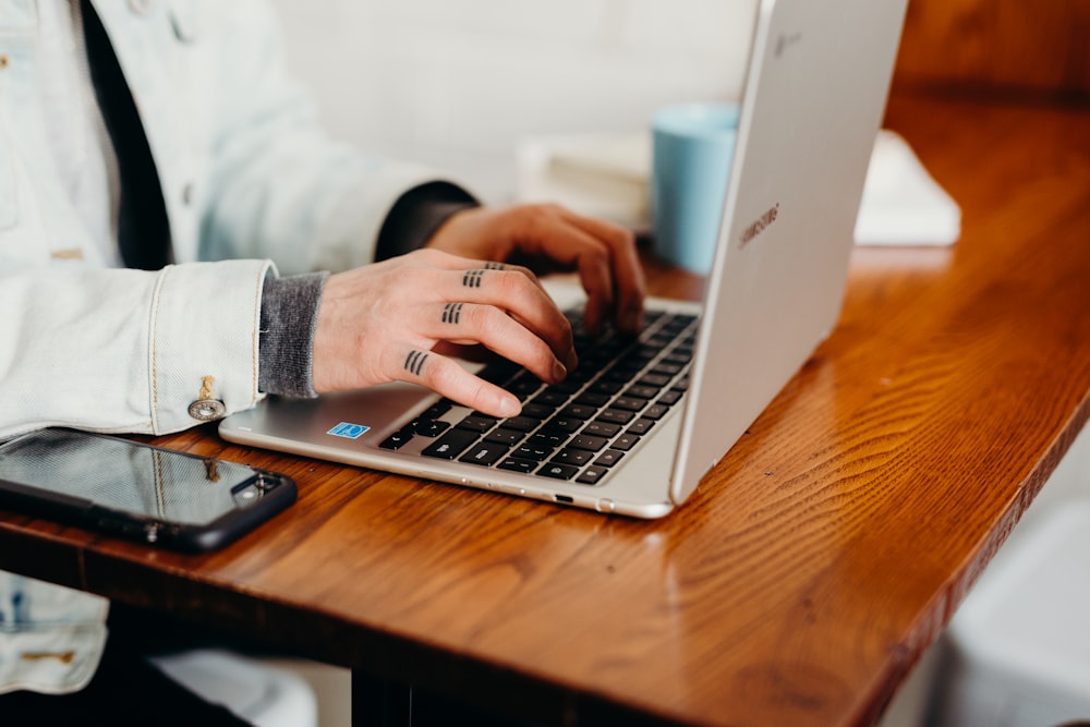 person using laptop computer