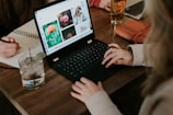 woman using black laptop computer
