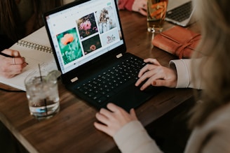 woman using black laptop computer