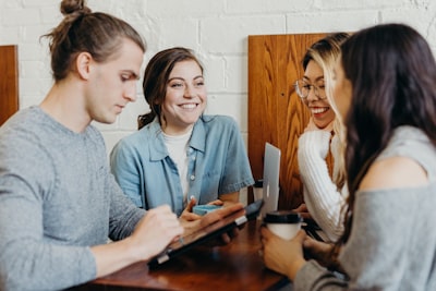 a group of friends at a coffee shop collaboration teams background