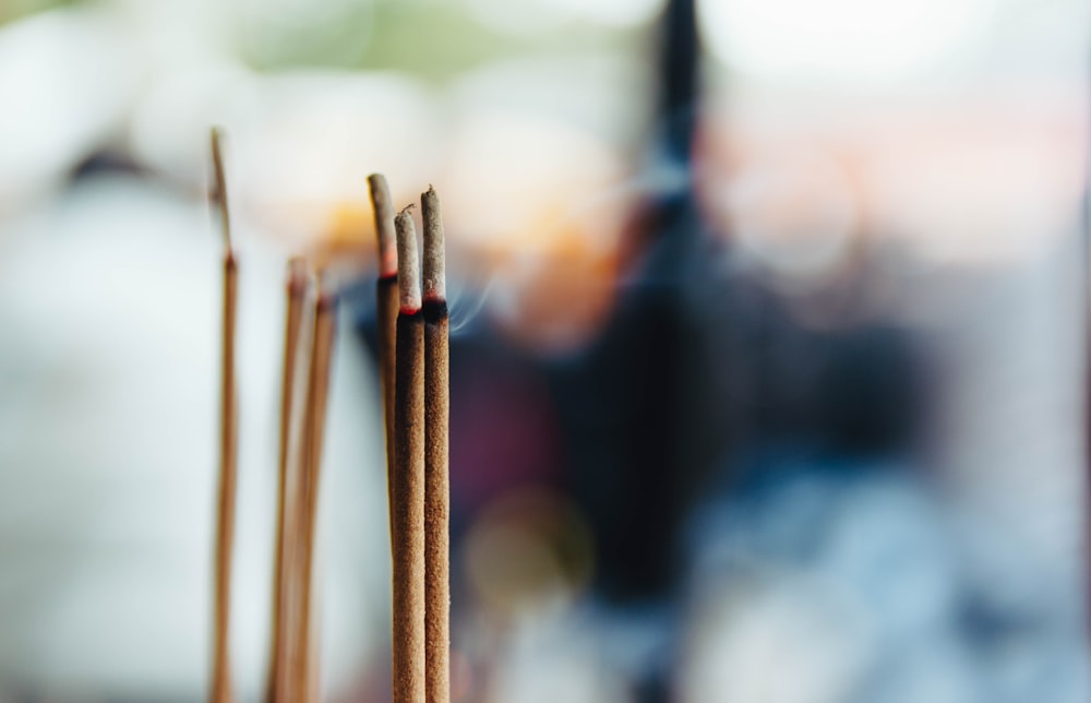 selective focus photography of incense stick