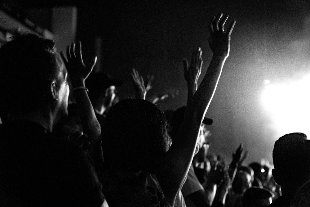 people raising their hands