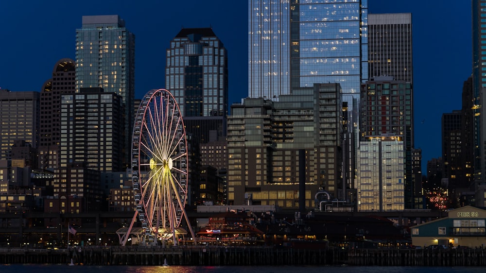 city with high-riser buildings at night time