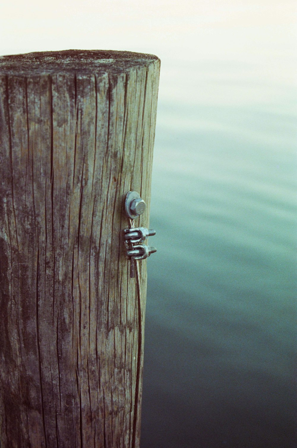 gray cable on wooden post