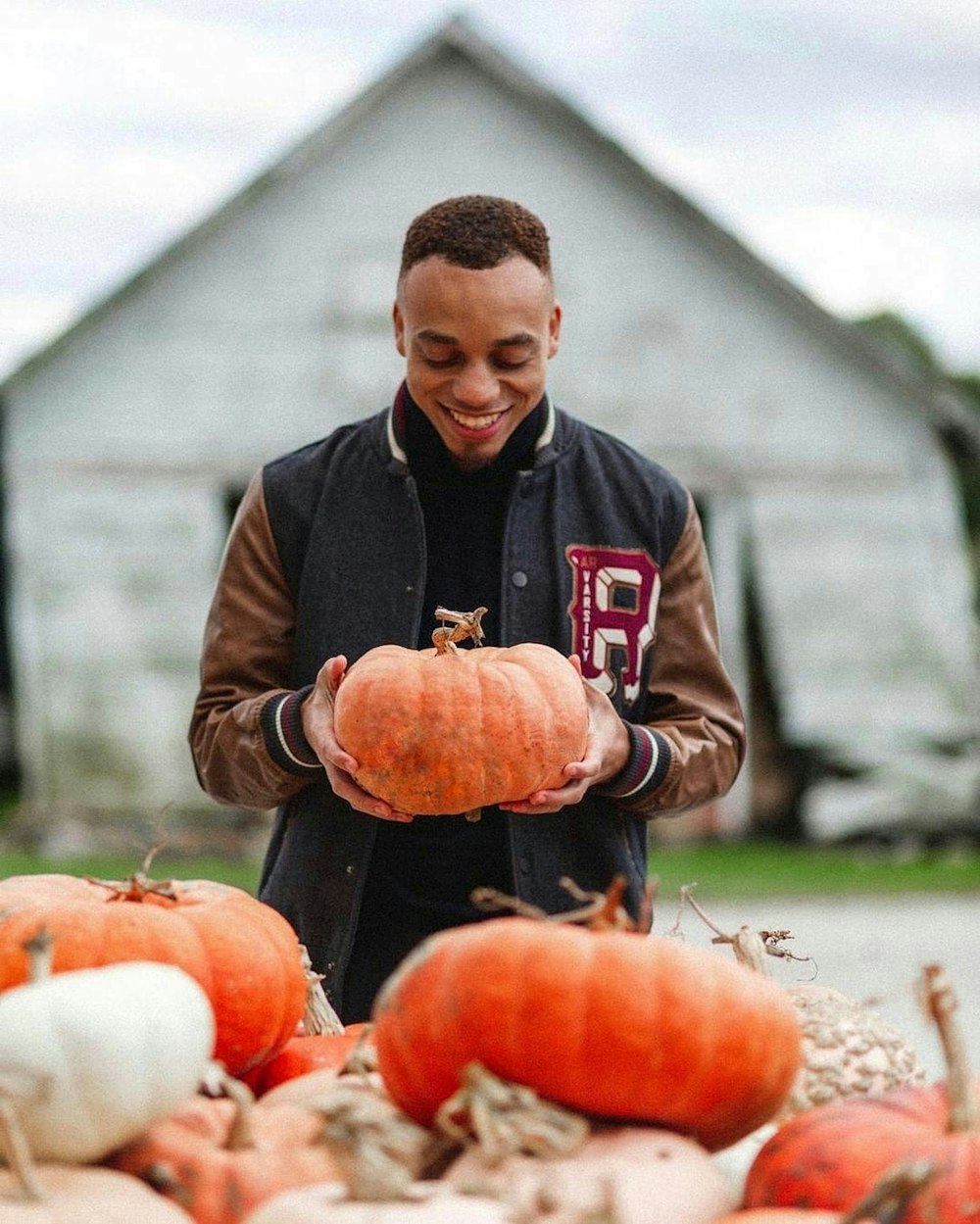 man holding pumpkin