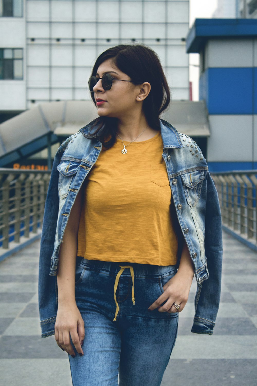 woman wearing blue denim jacket