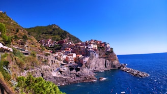 A picturesque view of the Amalfi Coast with colorful cliffside villages and sparkling blue waters.