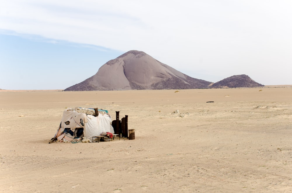 beige tent on sand