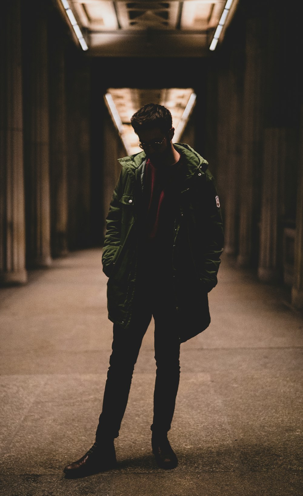 man wearing green jacket