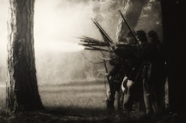 An old photograph of Polish soldiers in historical uniforms, capturing a moment from the past.