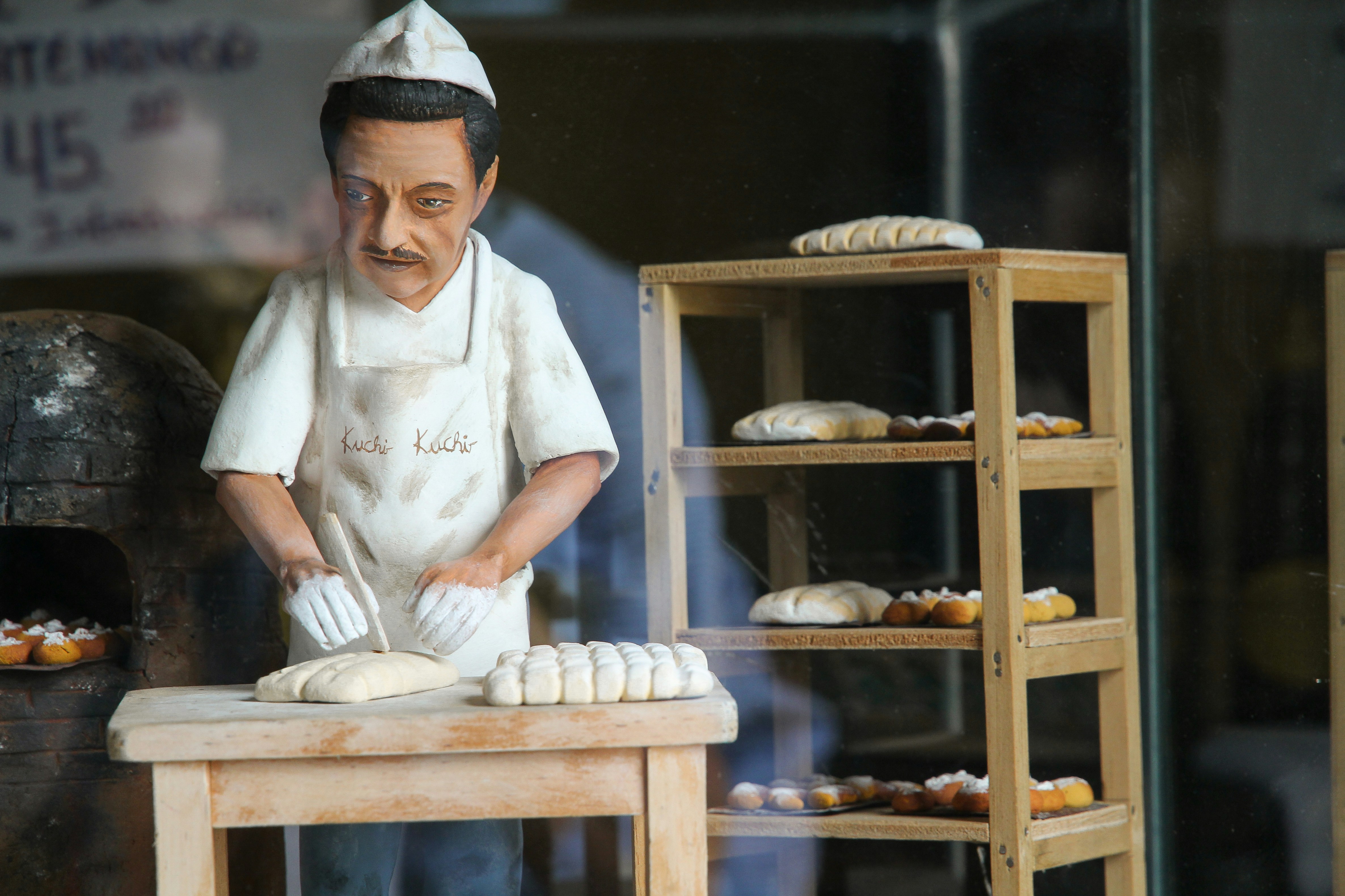 A small figurine in a pastry shop in Antigua, Guatemala.