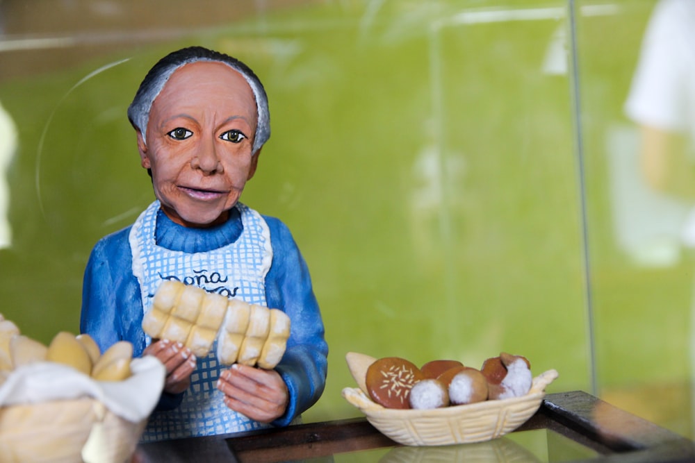 woman holding bread toy