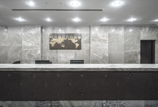 Grey Marble Reception — commercial reception interior design