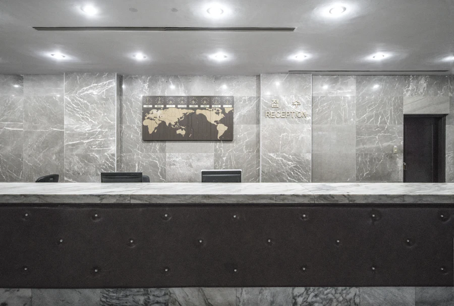 Commercial reception and lobby interior with stone counter and recessed lighting