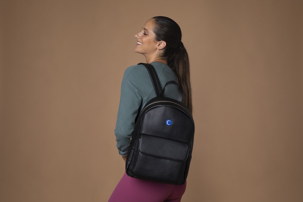 woman wearing black backpack