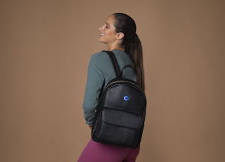 woman wearing black backpack