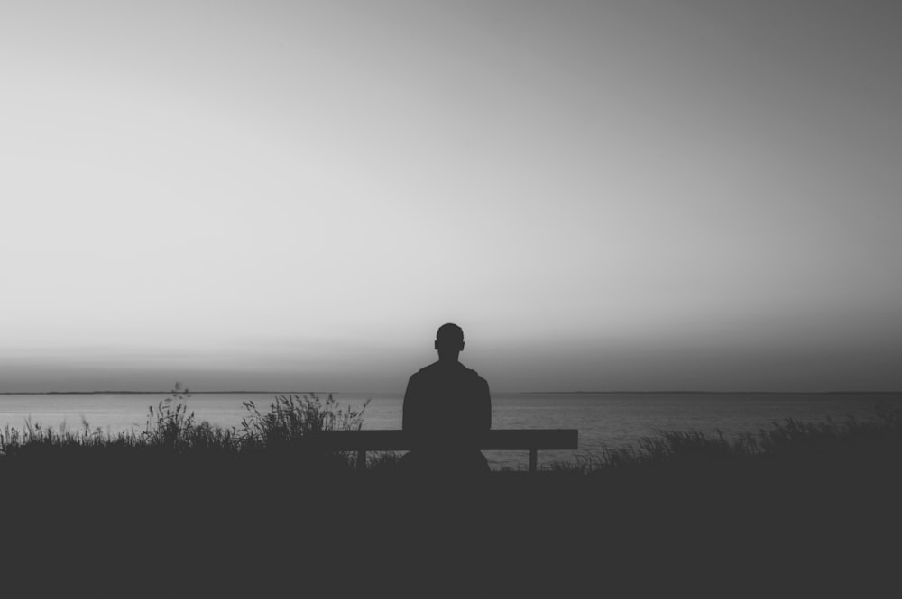 man sitting on bench