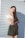 woman standing beside white wall
