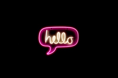 pink and yellow hello neon light sign zoom background