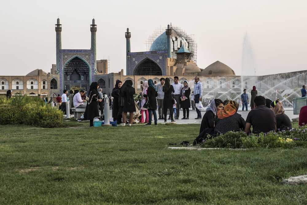 group of people near the outdoor fountain