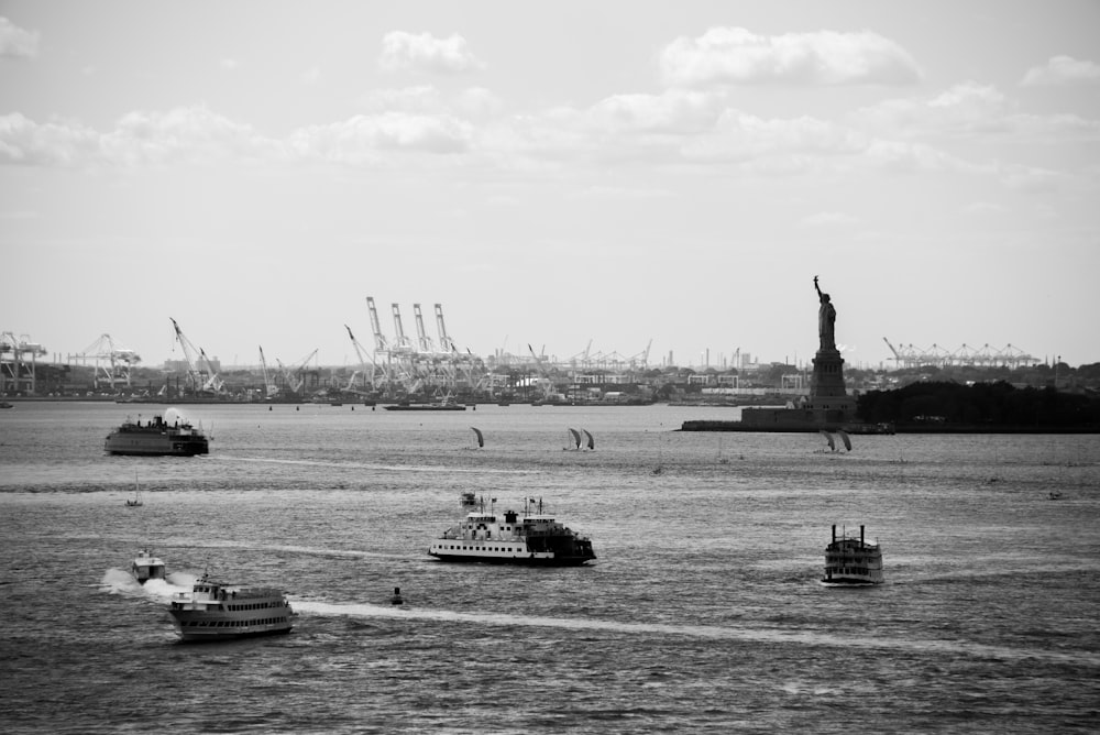 grayscale photo of ships on body of water