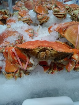 Bright orange crabs arranged neatly on rustic wooden surface
