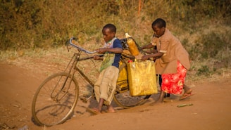 two kids using brown bike with cargo