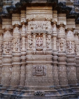 Skilled artisans carving stone at the temple construction site in Dhrangadhara.